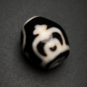 A Chinese Carved Agate DZI Bead