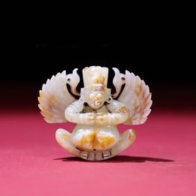 A Chinese Carved Jade Figure of Buddha Statuette