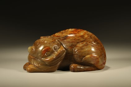 A Chinese Carved Jade Foo-Dog Statuette