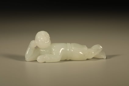 A Chinese Carved Jade Boy Statuette