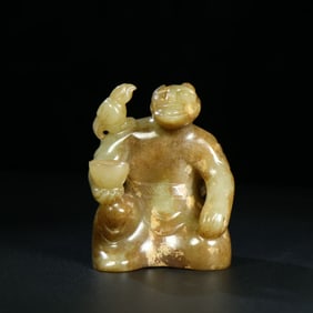 A Chinese Carved Jade Figure of Bird Trainer