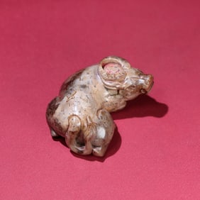 A Chinese Carved Jade Bull Statuette