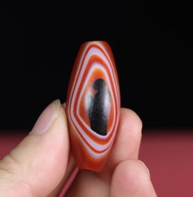A Chinese Carved Agate DZI Bead