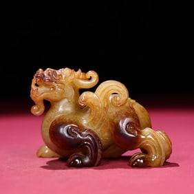 A Chinese Carved Jade Foo-Dog Statuette
