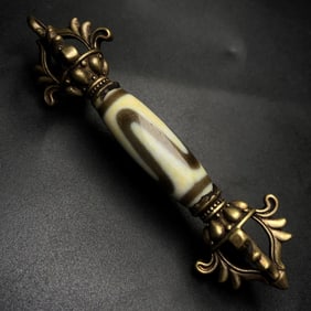 A Chinese Carved DZI Bead Instrument with Gilt Bronze Handle
