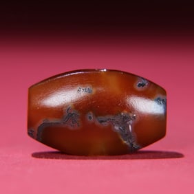 A Chinese Carved Agate DZI Bead