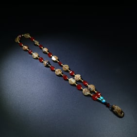 A Chinese Carved Jade and Agate Necklace
