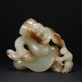 A Chinese Carved Jade Figure of Man and Boy