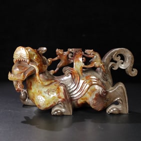 A Chinese Carved Jade Foo-Dog Statuette