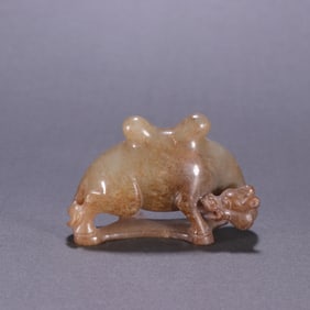 A Chinese Carved Jade Camel Statuette