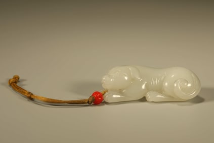 A Chinese Carved Jade Dog Statuette