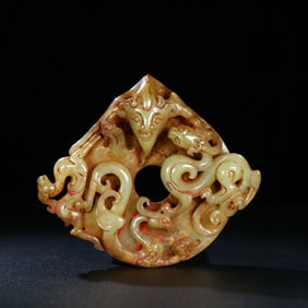 A Chinese Carved Jade Dragon, Phenix and Tiger Pendant