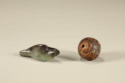 Two Chinese Carved Jade Beads