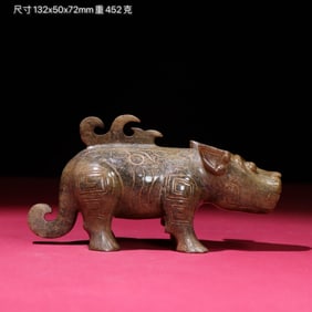 A Chinese Carved Jade Bull Statuette