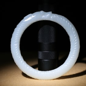 A Chinese Carved Jade Bangle