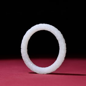 A Chinese Carved Jade Bangle
