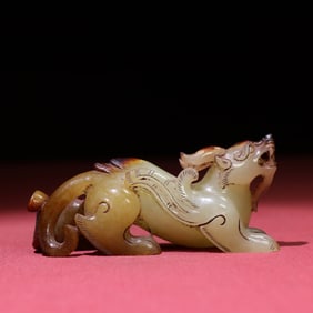 A Chinese Carved Jade Foo-Dog Statuette