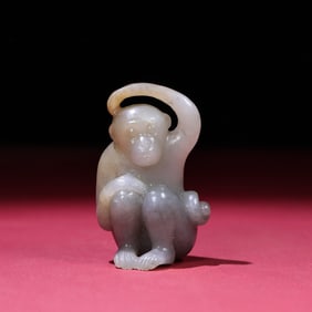 A Chinese Carved Jade Monkey Statuette