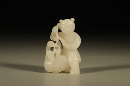 A Chinese Carved Jade Boy and Goose Statuette
