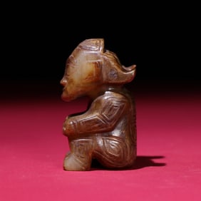 A Chinese Carved Jade Figure of Seated Man