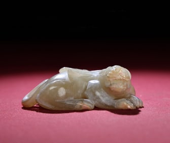 A Chinese Carved Jade Foo-Dog Statuette