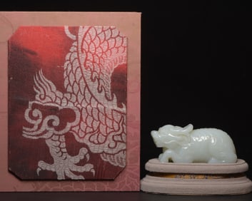 A Chinese Carved Jade Foo-Dog Statuette