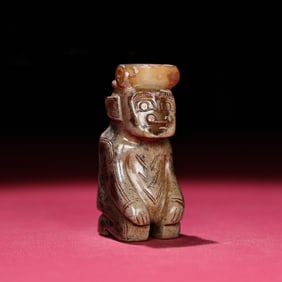 A Chinese Carved Jade Figure of Kneeling Man