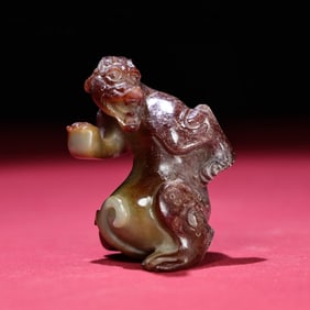 A Chinese Carved Jade Foo-Dog Statuette