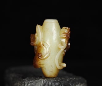 A Chinese Carved Jade Dragon Bead