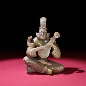 A Chinese Carved Jade Figure of Musician