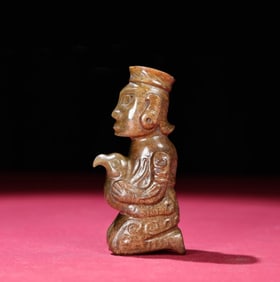 A Chinese Carved Jade Figure of Kneeling Man