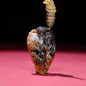 A Chinese Carved Jade Dragon Pendant
