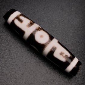 A Chinese Carved Agate DZI Bead