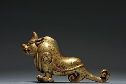 A Chinese Gilt Bronze Foo-Dog Statuette