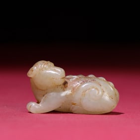 A Chinese Carved Jade Dog Statuette