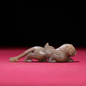 A Chinese Carved Jade Foo-Dog Belt Buckle