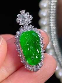 A Chinese Carved Jadeite Leaf Pendant