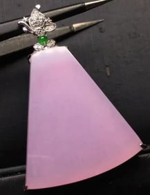 A Chinese Carved Jadeite Pendant