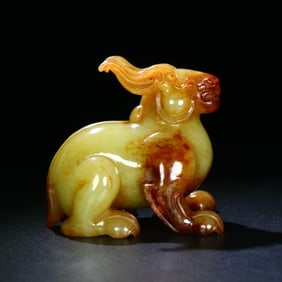 A Chinese Carved Jade Foo-Dog Statuette