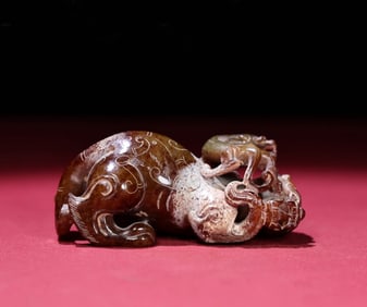A Chinese Carved Jade Foo-Dog Statuette