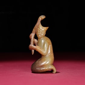 A Chinese Carved Jade Figure of Kneeling Man