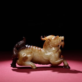 A Chinese Carved Jade Foo-Dog Statuette