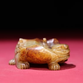 A Chinese Carved Jade Foo-Dog Statuette