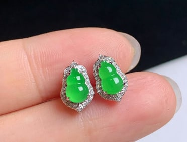 A Pair of Chinese Carved Jadeite Earrings