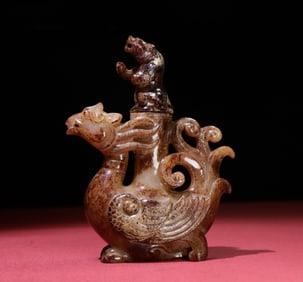 A Chinese Carved Jade Phenix and Bear Vase with Lid