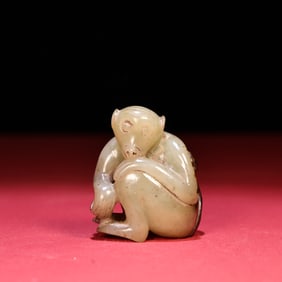 A Chinese Carved Jade Monkey Statuette