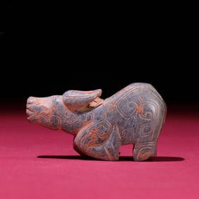 A Chinese Carved Jade Bull Statuette