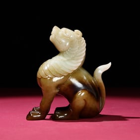 A Chinese Carved Jade Foo-Dog Statuette