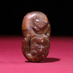 A Chinese Carved Jade Dragon and Phenix Statuette