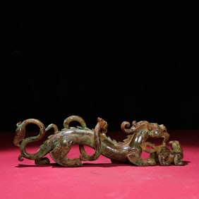 A Chinese Carved Jade Dragon Statuette